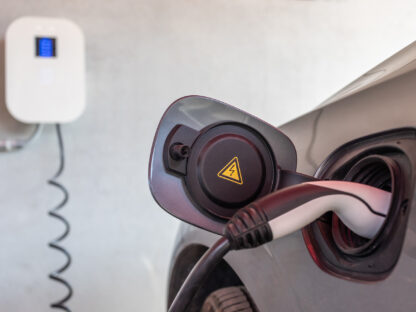 EV charger plugged into electric car.