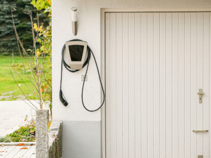 Legrand EV plugged into the wall of a house to charge an electric car.