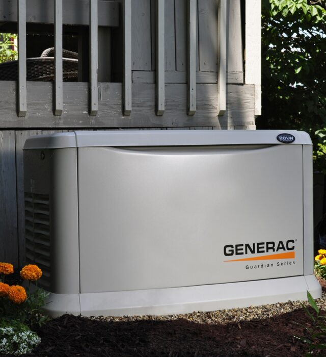 Generac whole-home generator installation next to wooden deck in college station, tx