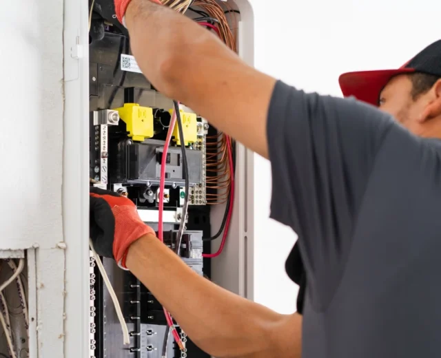 Electrician installing a SPAN electric panel for homeowner in texas